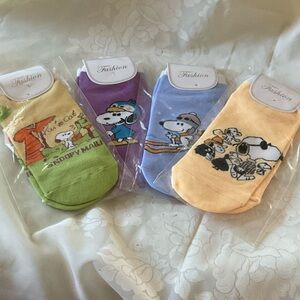 Snoopy Cartoon Character No Show Socks Set. Includes Four pair. Size 5.5-8
